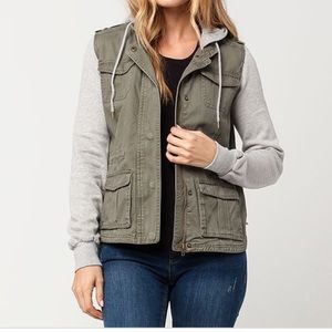 Green jacket with gray fleece sleeves and hood